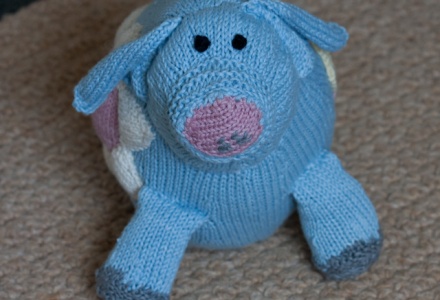 Rosie Pig front view - knitted soft toy in Rowan Purelife organic cotton DK.